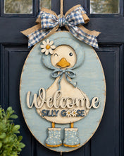 Load image into Gallery viewer, Decorative door hanger with a duck design and 'Welcome Silly Goose' text on a blue background.
